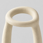 Close up of the smooth open upper rim of the Off-White sculptural ceramic candle holder.