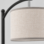 Close up of the weave or fabric texture of the shade on the Matte Black arched floor lamp.
