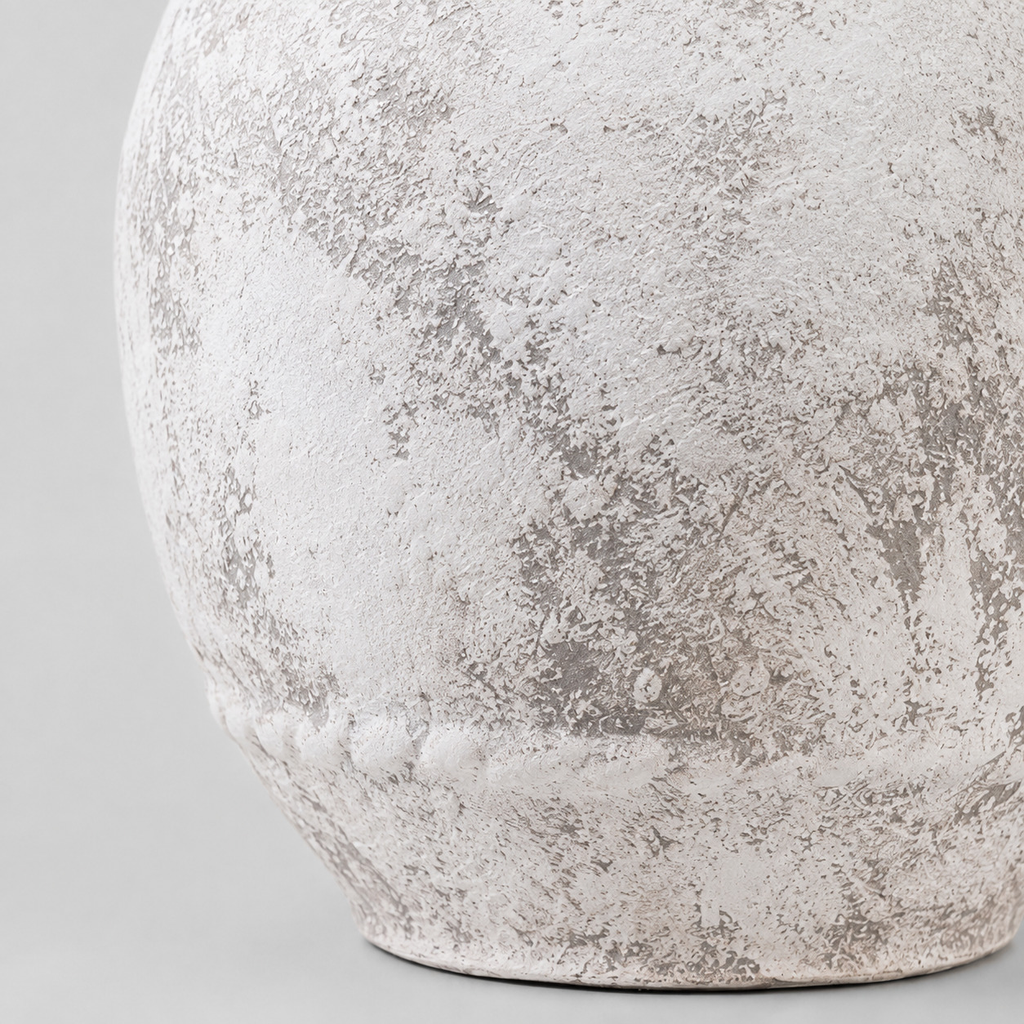 Close up of the distressed matte surface texture of the rustic textured ceramic urn vase