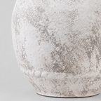 Close up of the distressed matte surface texture of the rustic textured ceramic urn vase