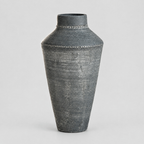 Antique Gray textured ceramic urn vase on a light gray studio background.