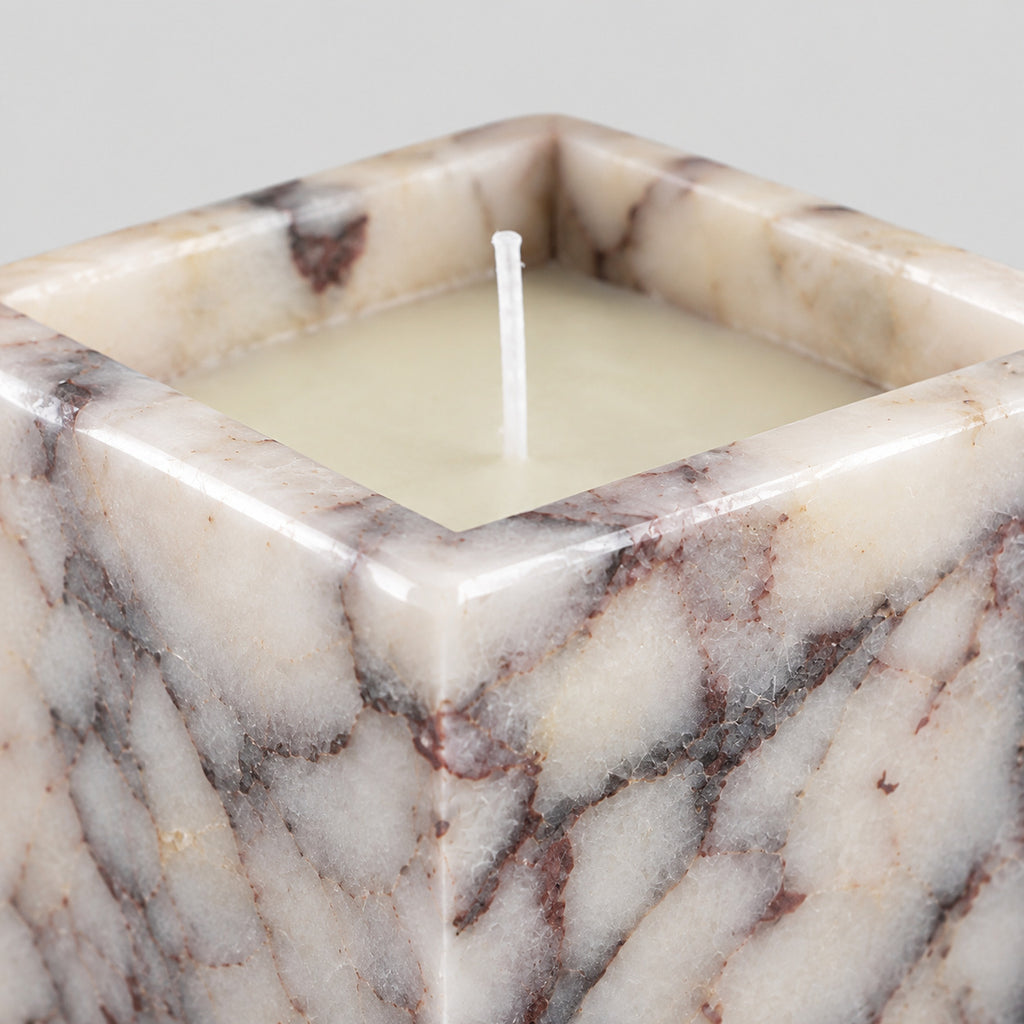 Close up of the polished upper rim of the Calacatta Viola square marble candle holder.