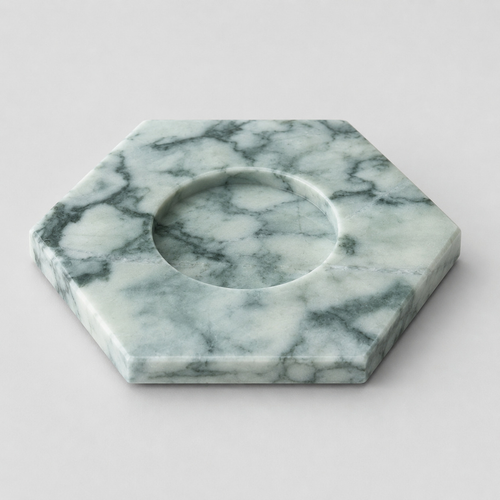 Green Marble hexagonal marble candle holder on a light gray studio background.