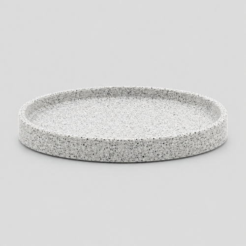 Speckled ceramic catchall tray in Speckled White on a light gray studio background, in its Round shape