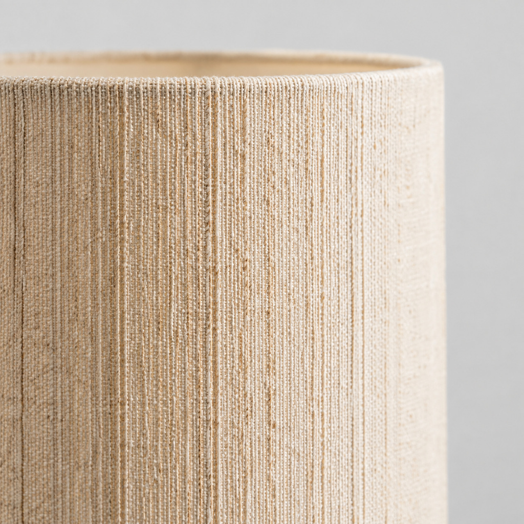 Close up of the weave or fabric texture of the shade on the Walnut stacked wood table lamp