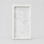 Rectangular marble vanity tray in Carrara White on a light gray studio background