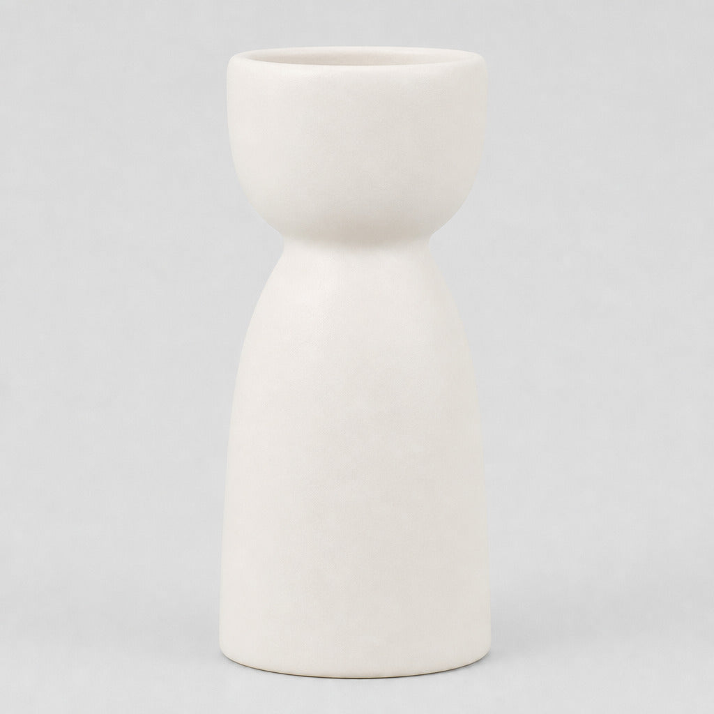 Matte ceramic taper candle holder in Matte White on a light gray studio background.