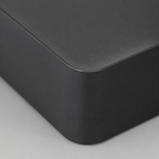 Close up of the smooth matte surface texture of the black square tissue box cover base.