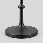 Close up of the circular cast-iron base of the Matte Black cast-iron taper candle holder