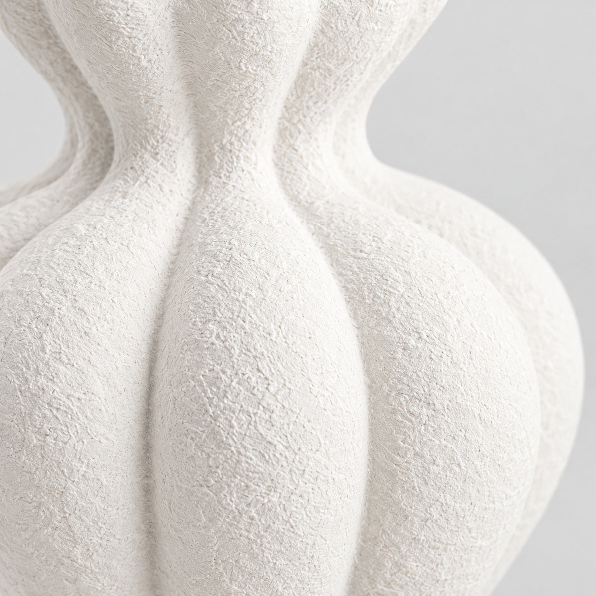 Close up of the textured matte ceramic glaze of the textured matte white ceramic vase in Matte White.
