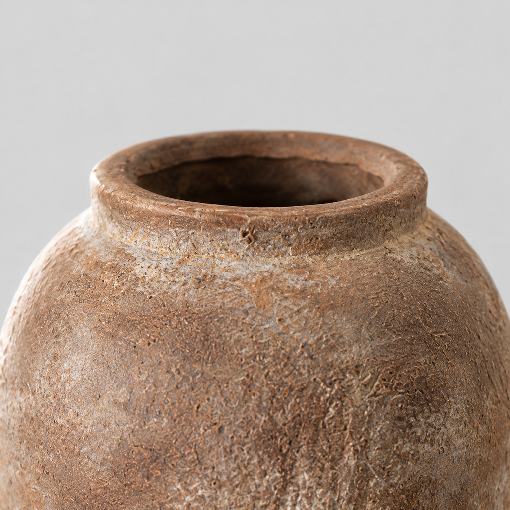 Close up of the rolled collar rim of the weathered ceramic vase in Dark Brown.