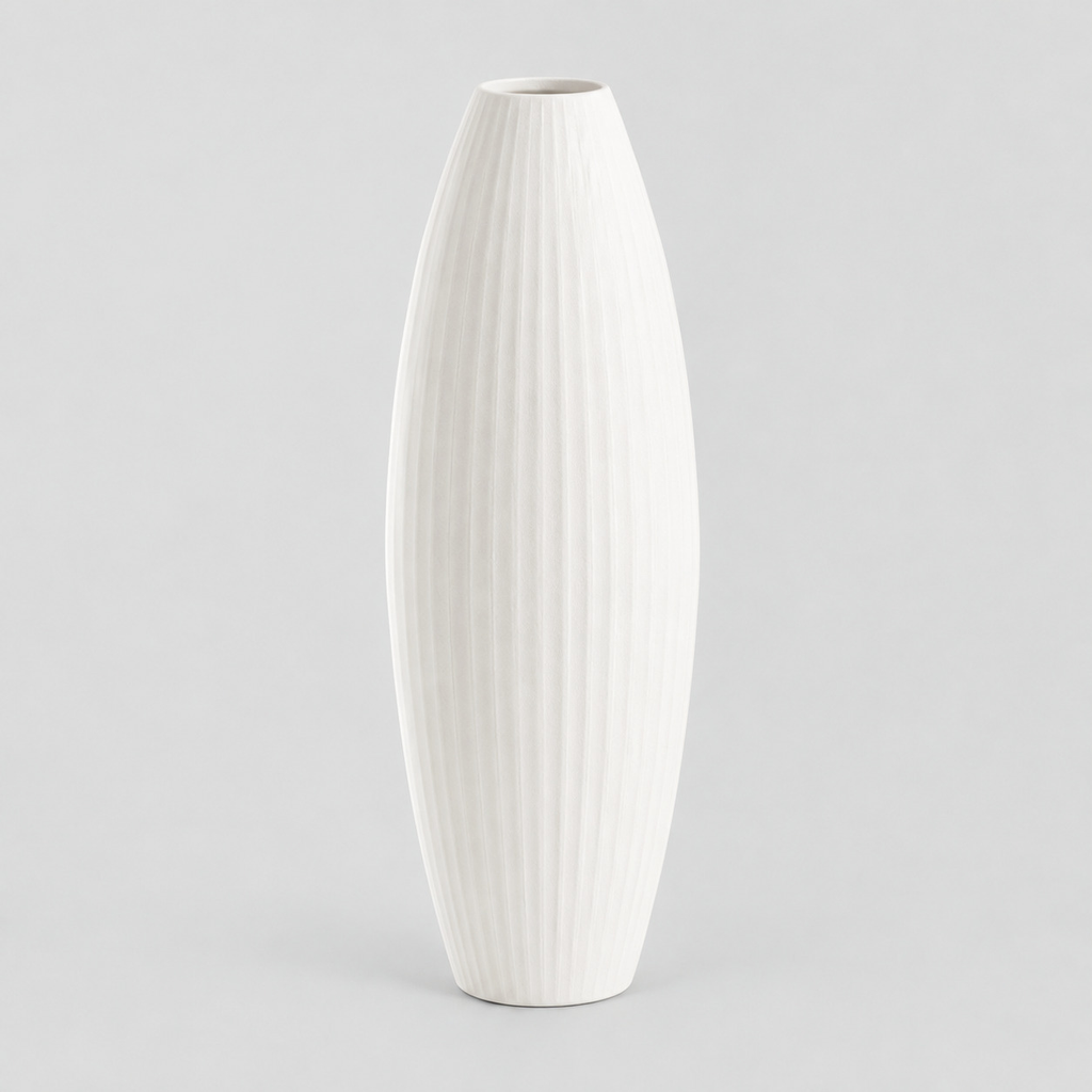 Matte white ribbed ceramic vase on a light gray studio background
