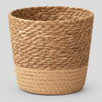 Natural Seagrass woven seagrass planter basket on a light gray studio background.