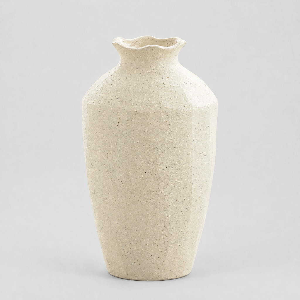 Textured ceramic vase in Cream on a light gray studio background.