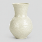 Textured ceramic vase in Off-White on a light gray studio background.