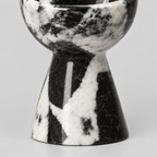Close up of the flared pedestal base of the Black Marble candle holder.