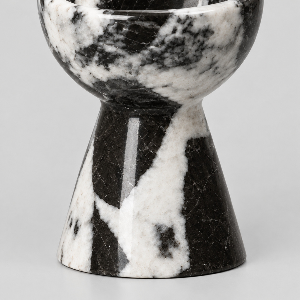 Close up of the flared pedestal base of the Black Marble candle holder.