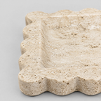 Close up of the scalloped rim of the scalloped square stone tray in Yellow Travertine.