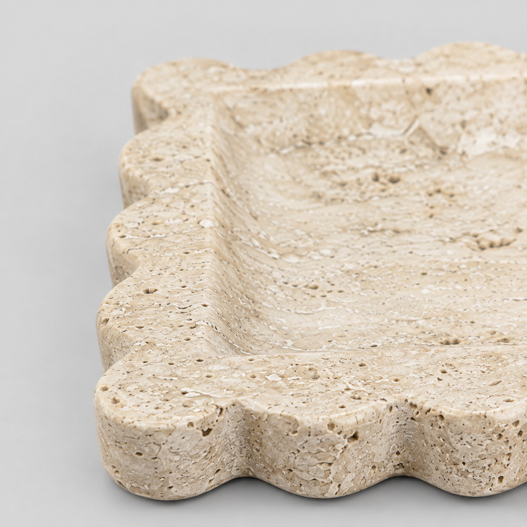 Close up of the scalloped rim of the scalloped square stone tray in Yellow Travertine.