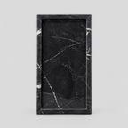 Rectangular marble vanity tray in Nero Marquina on a light gray studio background