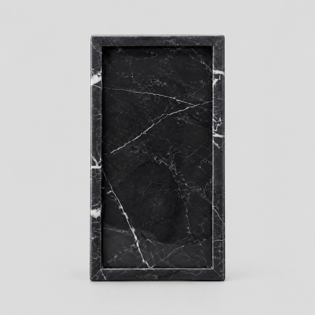 Rectangular marble vanity tray in Nero Marquina on a light gray studio background
