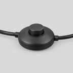 Close up of the foot switch on the cord of the Matte Black arched floor lamp.