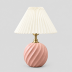 Fluted ceramic table lamp in Soft Pink on a light gray studio background