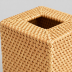 Close up of the tight weave of the natural rattan sides of the square woven rattan tissue box cover