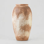 Textured ceramic vase in Weathered Terracotta on a light gray studio background.