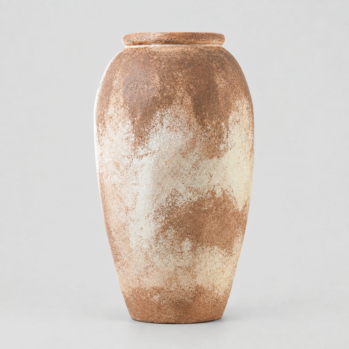 Textured ceramic vase in Weathered Terracotta on a light gray studio background.