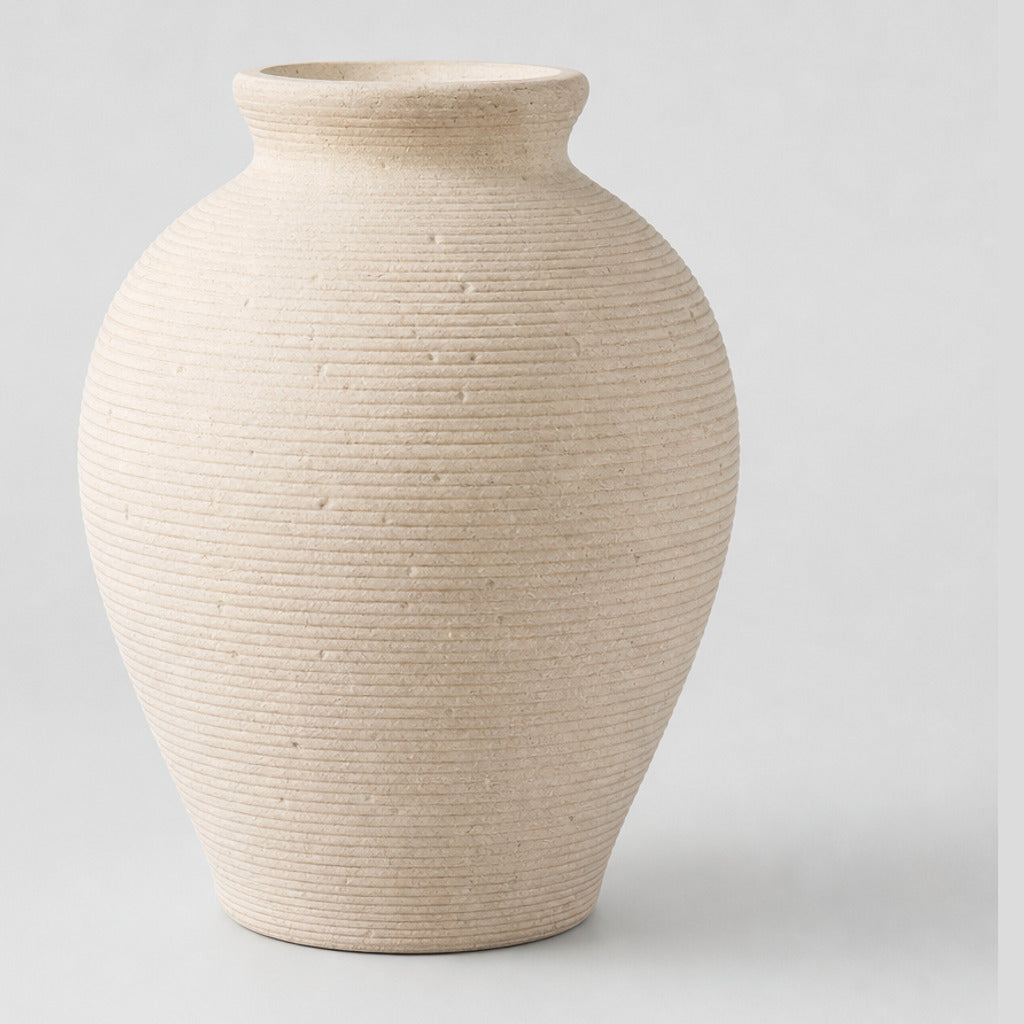 Off-white ribbed ceramic vase on a light gray studio background.