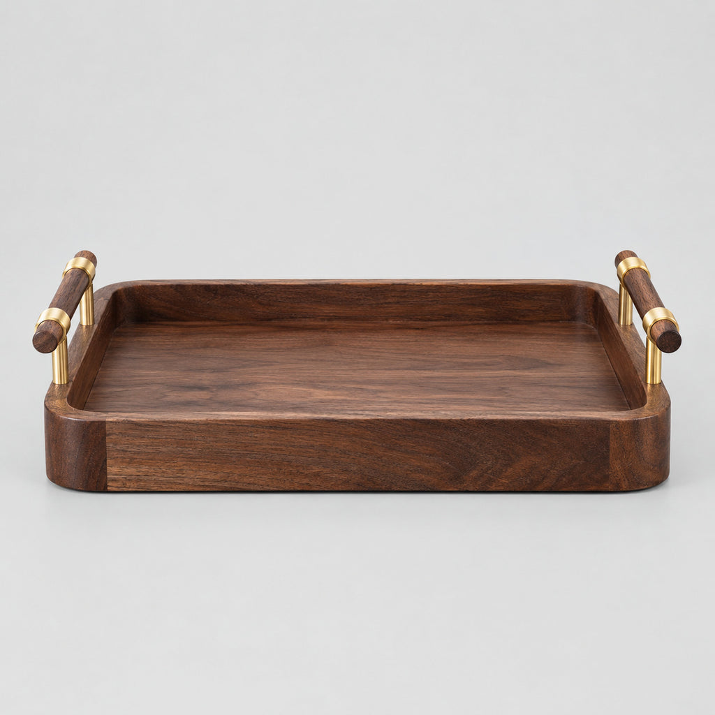 Rectangular walnut serving tray with brass handles in Walnut finish on a light gray studio background.