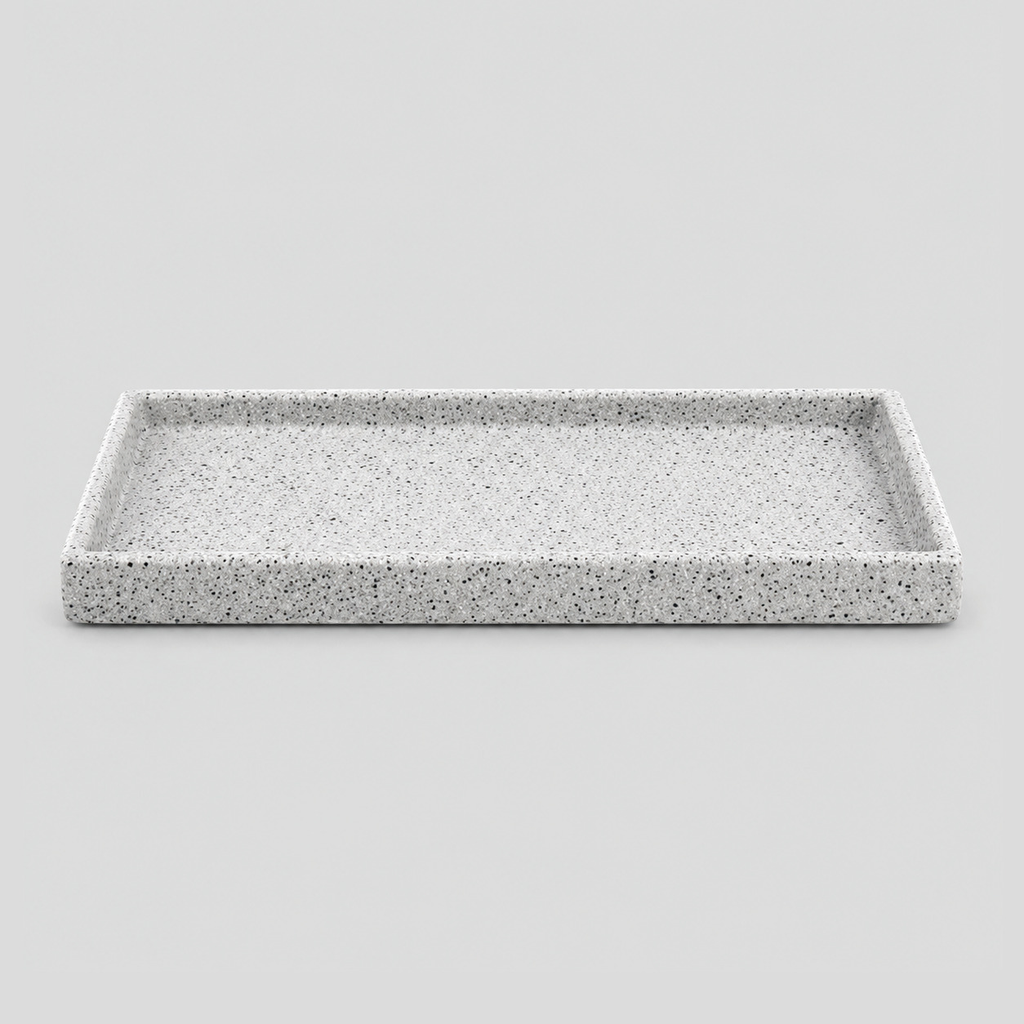 Speckled ceramic catchall tray in Speckled White on a light gray studio background.