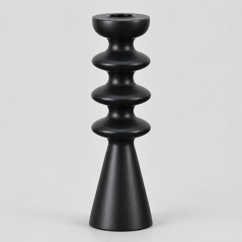 Matte black turned beechwood taper candlestick on a light gray studio background