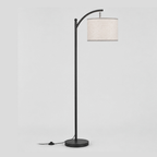 Matte Black arched floor lamp with a linen drum shade on a light gray studio background.