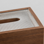 Close up of the reeded surface texture of the rectangular wooden tissue box cover.