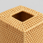 Close up of the braided rim around the top opening of the square woven rattan tissue box cover