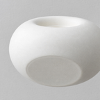 Close up of the smooth unglazed base of the Matte White ceramic donut candle holder.
