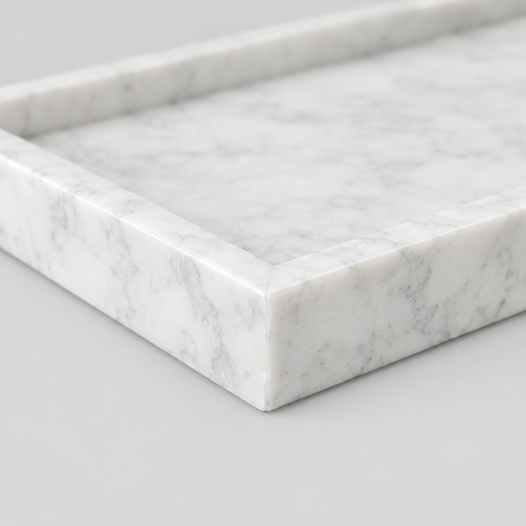 Close up of the mitered corner joint of the rectangular marble vanity tray in Carrara White