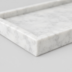 Close up of the mitered corner joint of the rectangular marble vanity tray in Carrara White