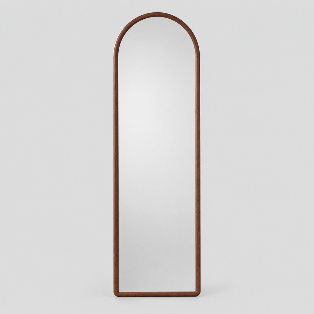Arched solid wood full-length mirror in Walnut finish on a light gray studio background.