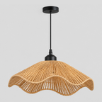 Wavy woven rattan pendant light in Natural Rattan on a light gray studio background