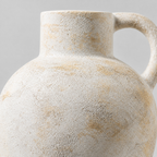 Close up of the distressed matte glaze texture across the rounded body of the Vintage Beige ceramic pitcher vase