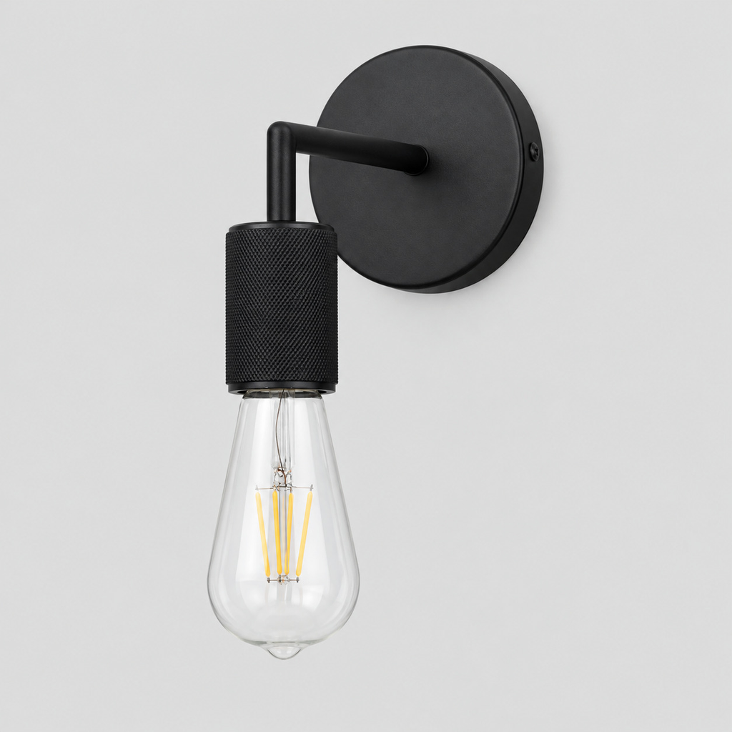 Matte Black knurled socket wall sconce on a light gray studio background