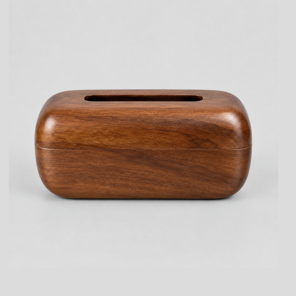 Curved solid wood tissue box cover in Walnut on a light neutral gray studio background.