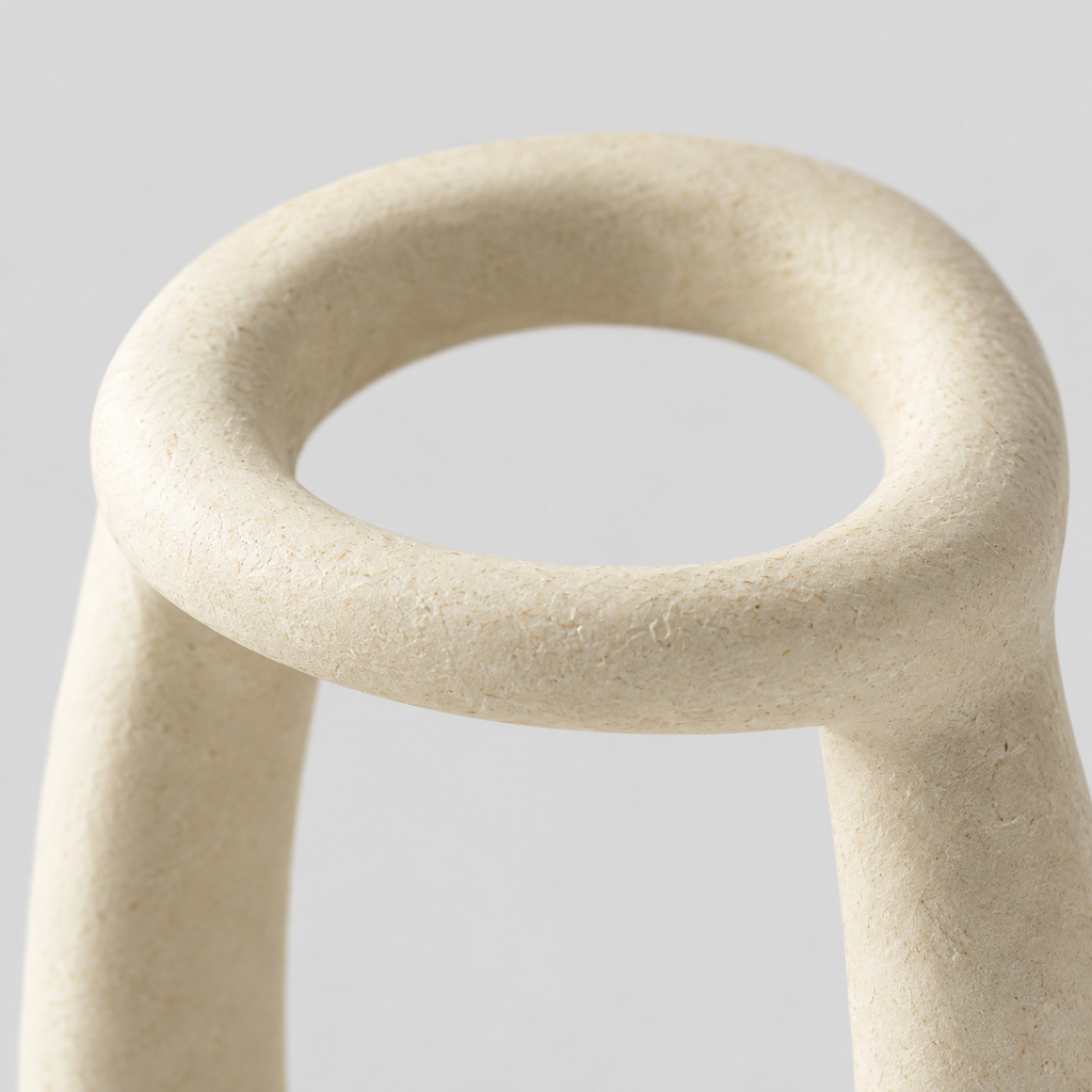 Close up of the matte stoneware surface texture of the Off-White sculptural ceramic candle holder.