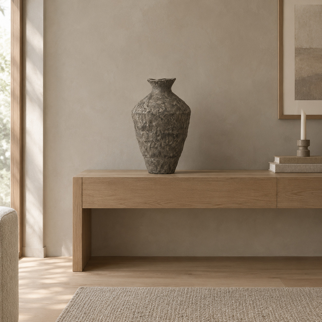 Textured ceramic urn vase in Charcoal finish on an oak console table in a calm room