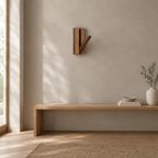 Natural Acacia fold-down wooden coat hook mounted on a greige plaster wall above a 120 cm wide low bench in a calm room