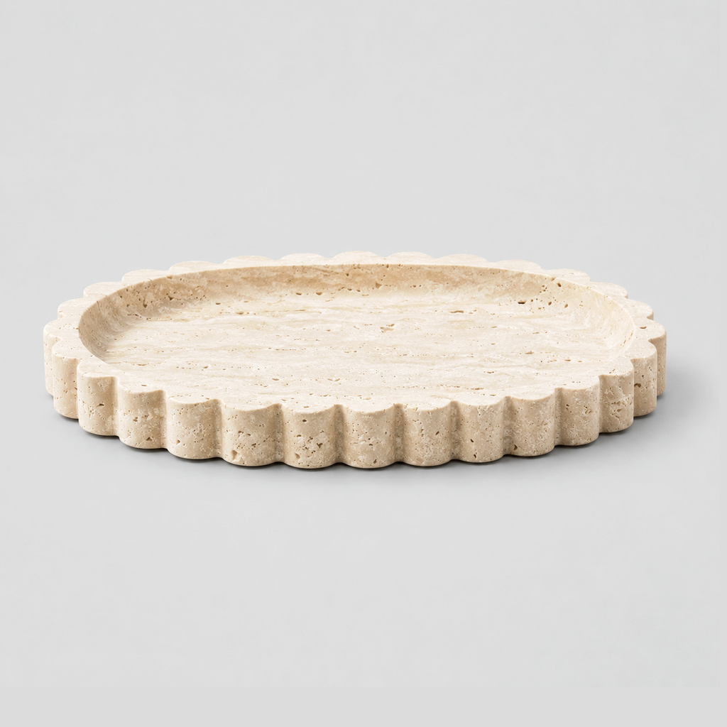 Scalloped oval travertine tray in Natural Travertine on a light gray studio background