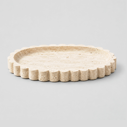 Scalloped oval travertine tray in Natural Travertine on a light gray studio background